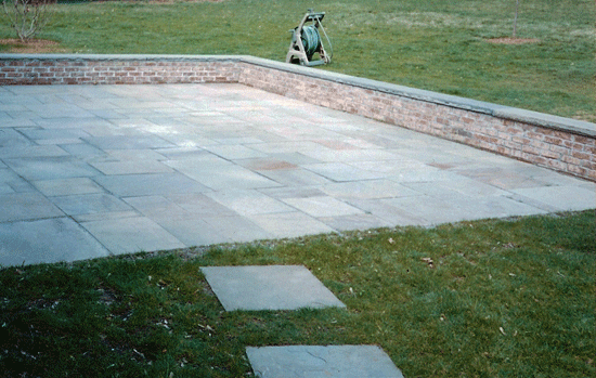 Bluestone Patio with Brick Wall